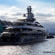 A large boat in the water next to a dock